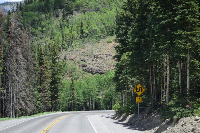 Lots of signs indicating squiggly roads and slow speed limits