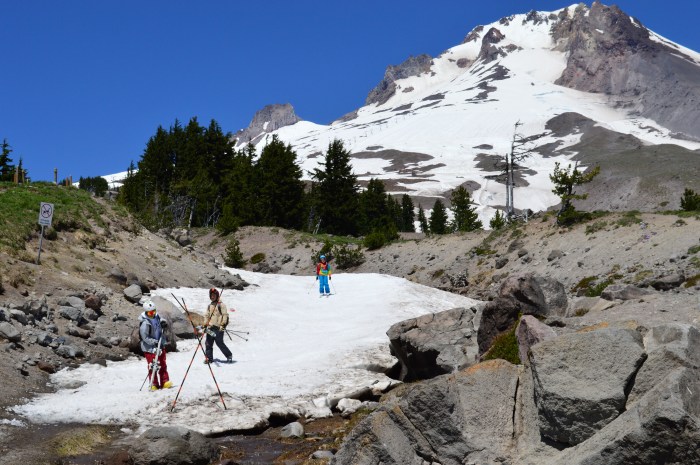 Skiers at Timberline in front of Mt Hood