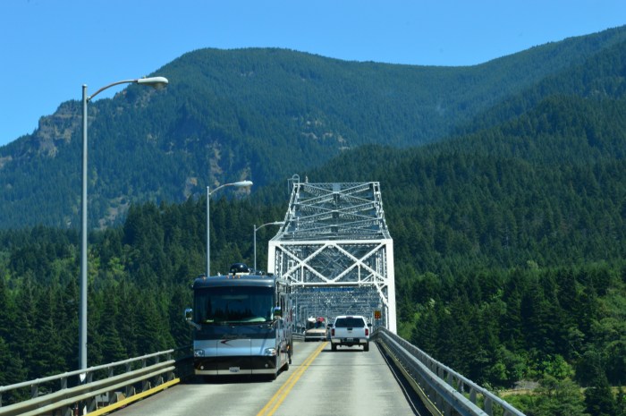 Two big RVs passing on a very narrow bridge